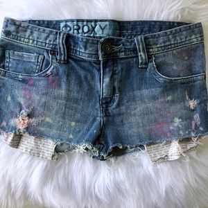 Roxy blue jean shorts with paint splatter design